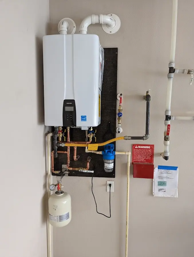 Professional plumber installing copper piping in a McKees Rocks home